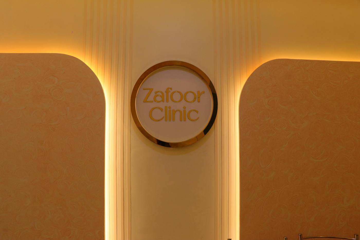 Zafoor Clinic gold circular wall signage